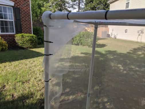 Wrap the PVC pipe structure on 5 sides with the garden netting and secure with zip ties